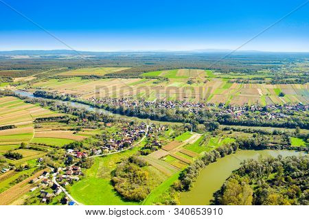 Beautiful Countryside Landscape In Croatia, Near Sisak, Sava River Meandering Between Agriculture Fi