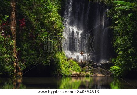 Woman near Labuhan Kebo Waterfall located in Munduk, Bali
