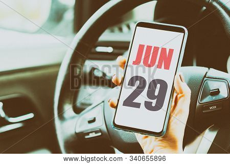 June 29th. Day 29 Of Month, Calendar Date. Month And Day Placed On A Smartphone Screen In Womans Han