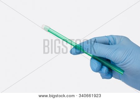Dentists Hand In Glove With A Saliva Ejector.