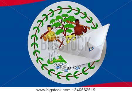 Belize Flag Depicted On Paper Origami Ship Closeup. Handmade Arts Concept