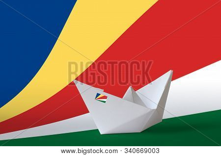 Seychelles Flag Depicted On Paper Origami Ship Closeup. Handmade Arts Concept