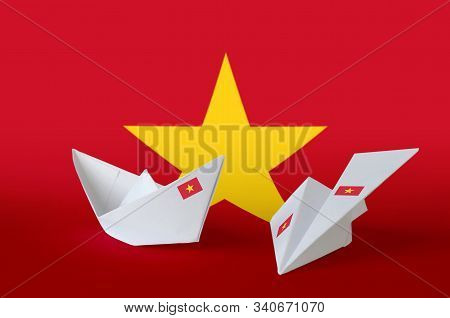 Vietnam Flag Depicted On Paper Origami Airplane And Boat. Handmade Arts Concept