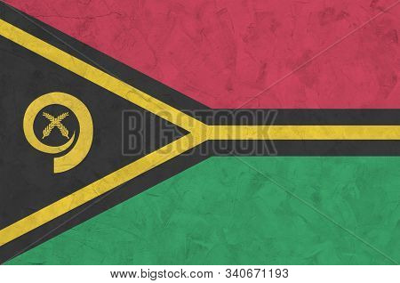 Vanuatu Flag Depicted In Bright Paint Colors On Old Relief Plastering Wall. Textured Banner On Rough