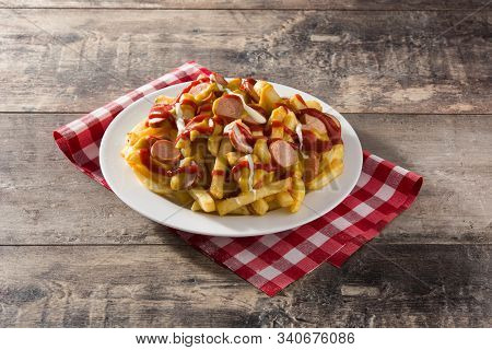 Typical Latin America Salchipapa. Sausages With Fries, Ketchup