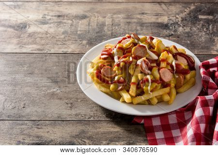 Typical Latin America Salchipapa. Sausages With Fries, Ketchup. Copy Space