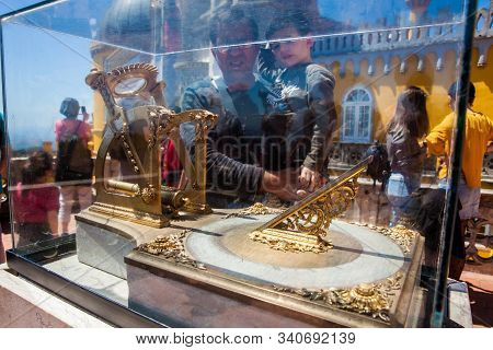 Sintra, Portugal - May, 2018: Tourists Looking At A Sundial At The Pena Palace A Romanticist Castle 