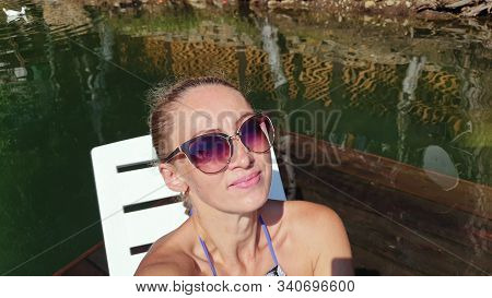 Woman Shooting Self Portrait. Take Photo And Video On Smartphone. Girl Rest, Relax, Walk In Sunglass