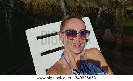 Woman Shooting Self Portrait. Take Photo And Video On Smartphone. Girl Rest, Relax, Walk In Sunglass