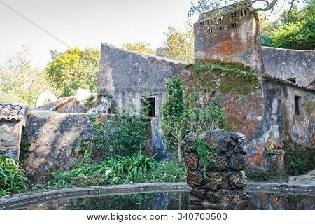 Ancient Rocks Of Fountain, Stone Building. Convent Of The Capuchos
