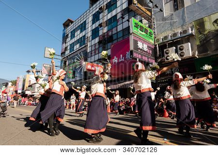 Puli, Taiwan - December 14th, 2019: people parade in Puli carnival at Nantou, Taiwan