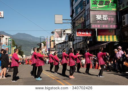 Puli, Taiwan - December 14th, 2019: people parade in Puli carnival at Nantou, Taiwan