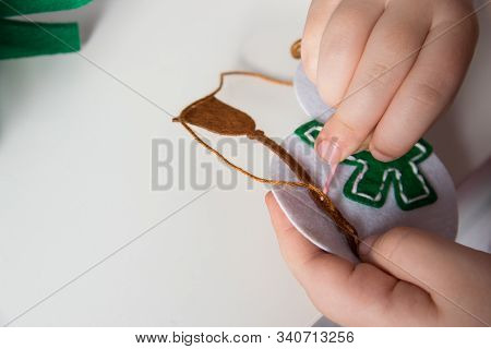 The Hand Of The Child Make Snowman And Christmas Tree With Needle, Thread For Christmas Greeting Car
