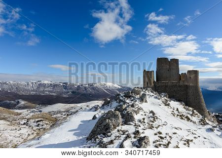 Ancient Fortress In The Abruzzesi Mountains, Snowy Mountain Landscape Of Campo Imperatore - Piana De