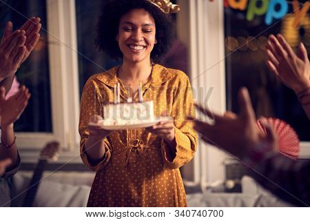 Young  cheerful birtday girl with birtday cake