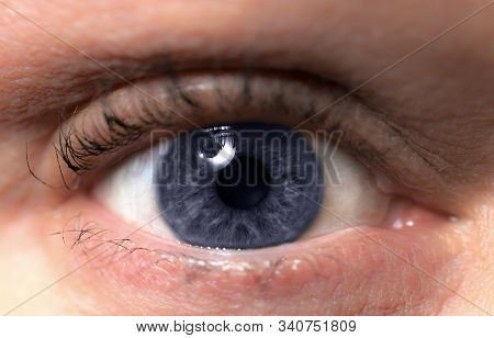 Single Blue Eye With Mascara. Older Woman Healthy Eye Close Up With Catch Light.
