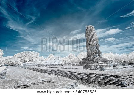 Ruined Ancient Buddhist Temple And Pagoda In Ayutthya Historical Park, Thailand In Infrared Photogra