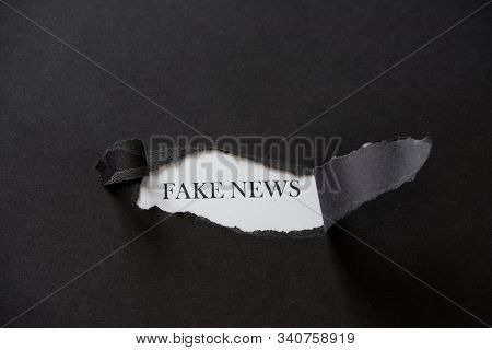 False News Printed On A White Background With Black Torn Paper.