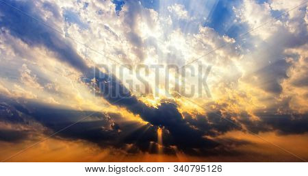 Sun Hiding In Clouds At Sunset