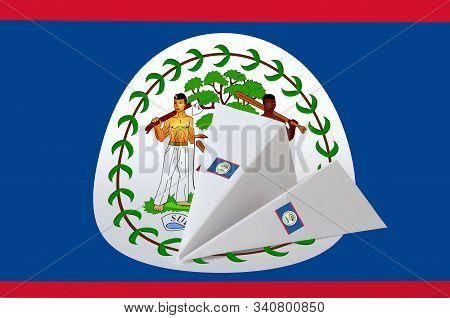 Belize Flag Depicted On Paper Origami Airplane. Handmade Arts Concept