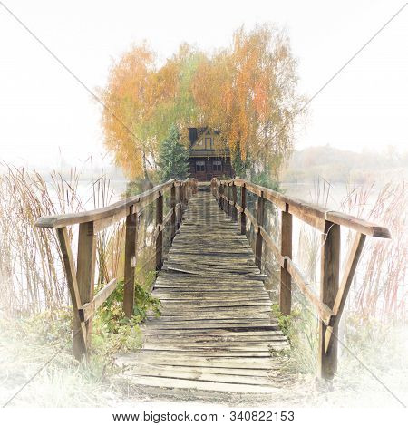 Hunter And Fishermans House With Wooden Footbridge On An Island In The Middle Of A River. Stary Solo