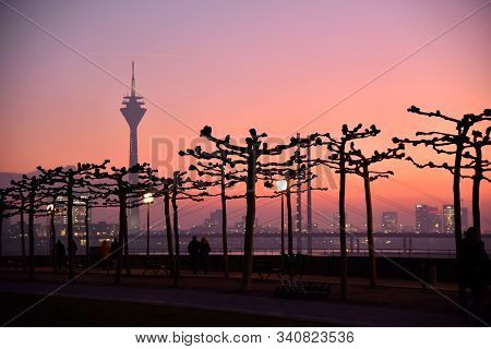 Dusseldorf, Germany - December 3, 2019: Romantic Scenery With People Walking At Rhine River In The S