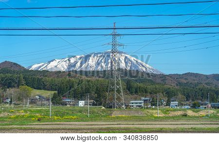Snow Capped Mount Iwate With Clear Blue Sky Natural Background, Beauty Townscape Of Takizawa And Shi