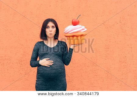 Pregnant Woman Craving Sweets Holding Huge Cupcake