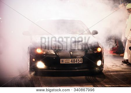 Dubai, Uae - November 15, 2018: American Muscle Car Pontiac Gto Making A Burnout At The Annual Gulf 