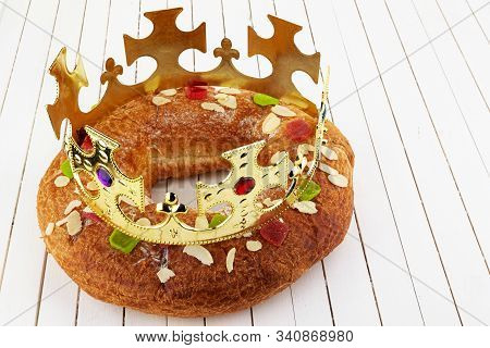 Epiphany Cake, Kings Cake, Roscon De Reyes Or Rosca De Reyes On Wooden Table