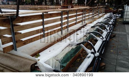 Artificial Ice Rink In The City Center. Equipment For Creating Ice Cover. Slippery Ice That Is Easy 