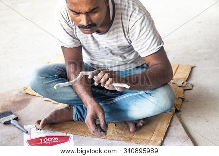 Tovp, Mayapur. West Bengal, India. - Dec 16, 2019. Artisan Working On Sculpture On The Building Of T