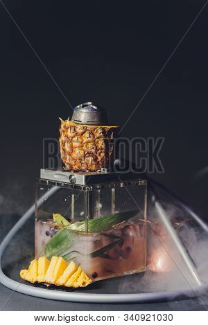 Shisha With Fruit Bowl With Colorful Smoke In Hookah Bar Closeup.