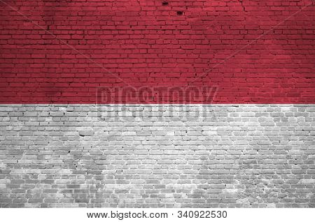 Indonesia Flag Depicted In Paint Colors On Old Brick Wall. Textured Banner On Big Brick Wall Masonry