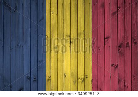Chad Flag Depicted In Bright Paint Colors On Old Wooden Wall. Textured Banner On Rough Background