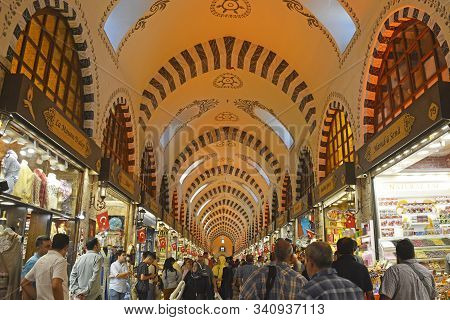 Istanbul, Turkey - September 19th 2019. Tourists Walk Past Shops Selling Spices, Teas, Dried Fruit A