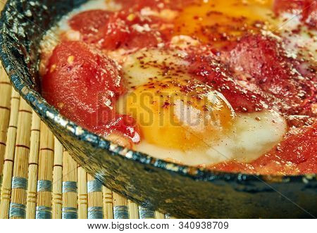 Chakchouka,eggs In Tomato Sauce . Tunisian Cuisine, Traditional Assorted African Dishes, Top View.