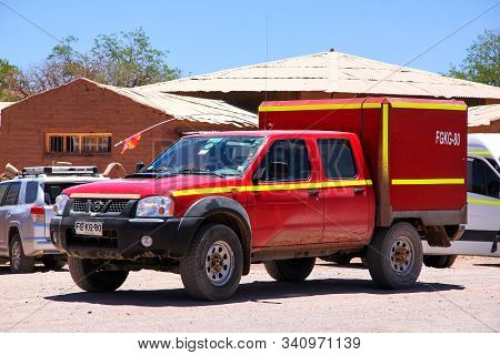 San Pedro De Atacama, Chile - November 17, 2015: Red Pickup Truck Nissan Terrano In The Town Street.