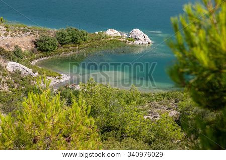 Scenic View At The Gadoura Water Reservoir On Rhodes Island, Greece With Blue And Turquoise Water An