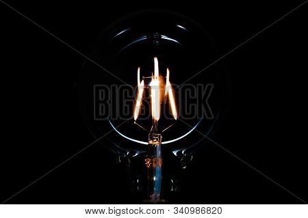The Edison Bulb Light In The Darkness
