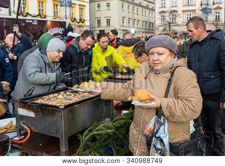 Cracow, Poland - December 15, 2019: Christmas Eve For Poor And Homeless On The Main Square In Cracow