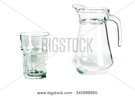 An Empty Glass Glass And A Carafe For Water Stand On A White Background