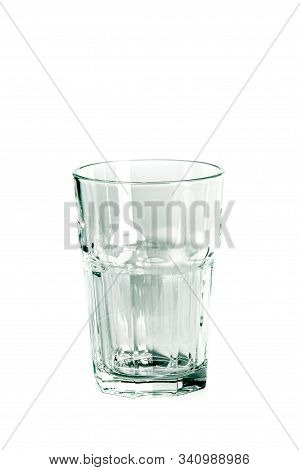 An Empty Glass Glass And A Carafe For Water Stand On A White Background