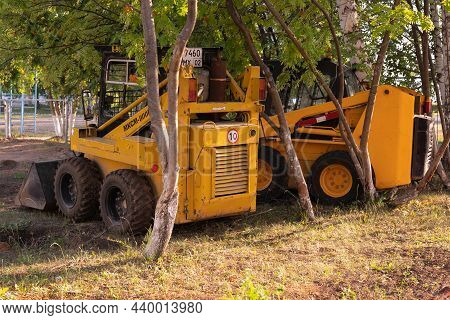 Mini Loader With A Yellow Bucket. Tractor Mksm 800 In The Parking Lot: Agidel, Russia 19.07.2021
