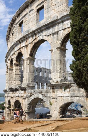 Pula, Croatia - September 4, 2012: The Walls Of Roman Amphitheatre In Pula, A View From The Outside.
