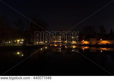 Zatka Embankment In City Ceske Budejovice With Bridge Near Meeting Two River Malse And Vltava At Nig