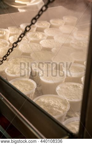 Process Of Making Fresh White Soft Ricotta Whey Cheese On Small Cheese Farm In Parma, Italy