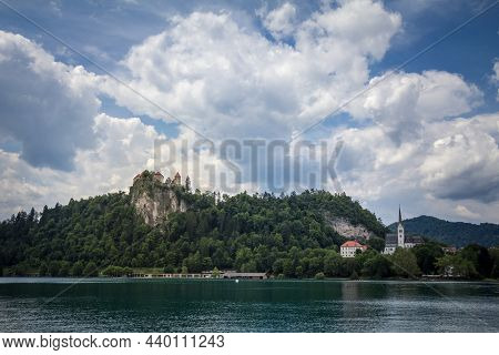 Panorama Of The Bled Lake, Blejsko Jezero, With Its Castle, Blejski Hrad, During A Cloudy Summer Wit