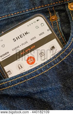 Smartphone In The Front Pocket Of A Jean, On The Screen Shein App.
