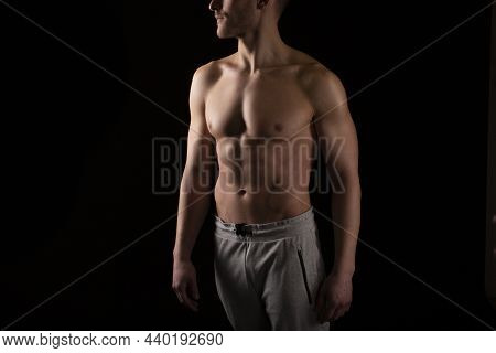 Man Showing Abs. Muscle Man Posing. Strong Body Concept. Topless Sport Man Bodybuilder. Six Pack Spo